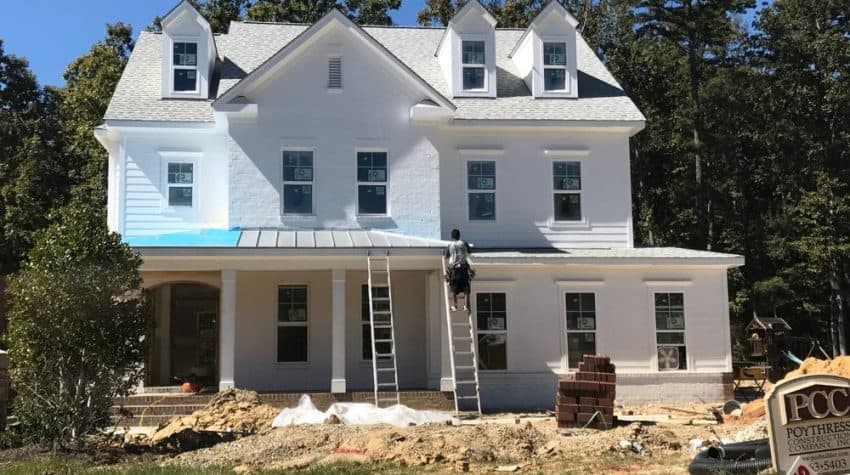 white brick house in the building construction phase