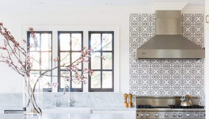 black window frames in a kitchen with navy island